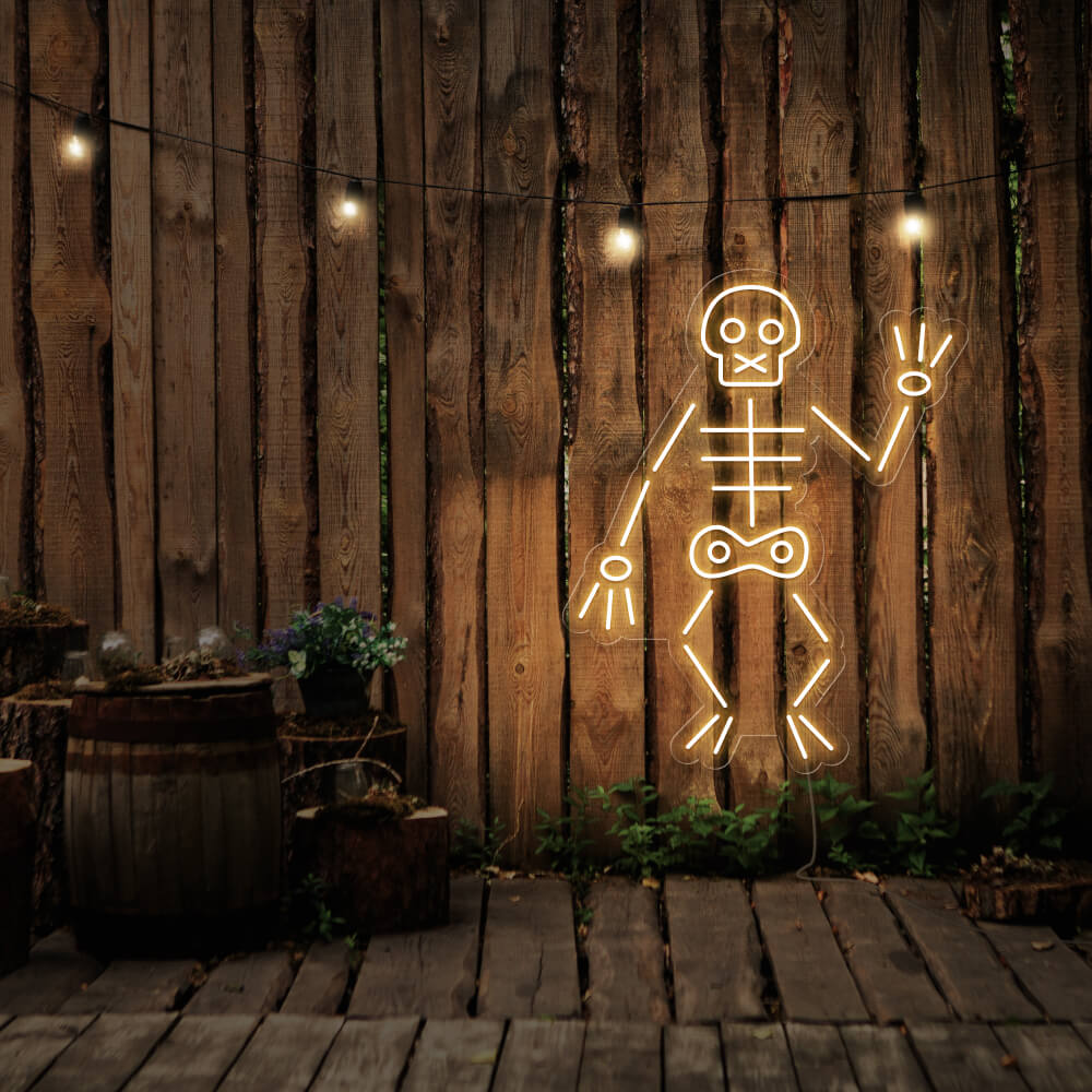 warm white skeleton neon sign hanging on timber fence