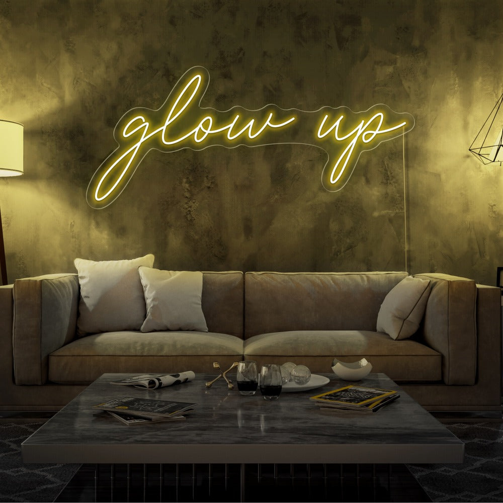 yellowe glow up neon sign hanging on living room wall