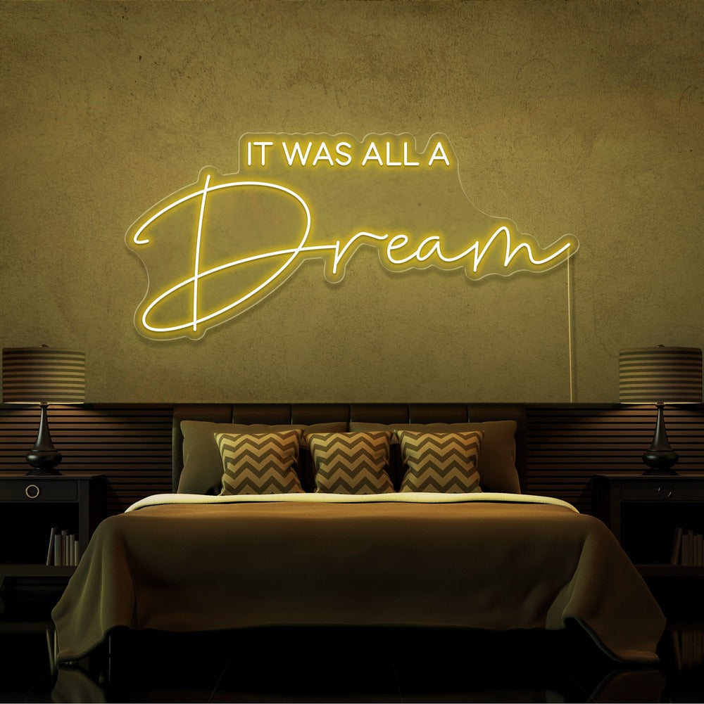 yellow it was all a dream neon sign hanging on bedroom wall