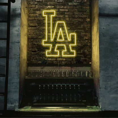 yellow LA neon sign hanging on bar wall